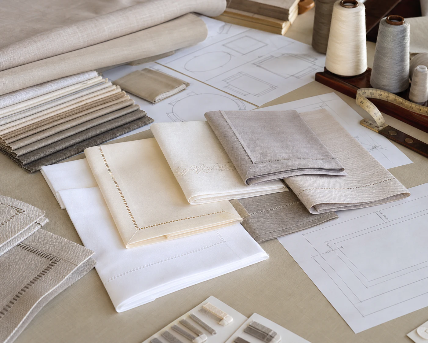 Table-linen swatches, napkin finishes, and dimensions arranged for a dining specification.